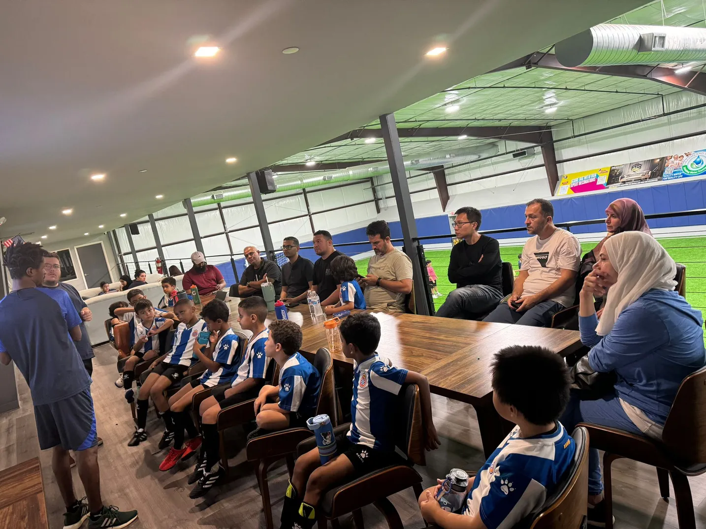 Parents and players gathered for an academy meeting indoors